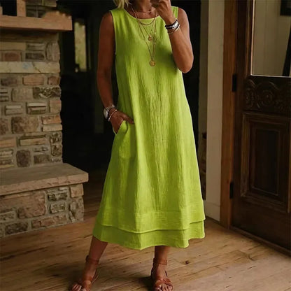 Vestido midi mujer sin mangas con bolsillos y bajo con volante