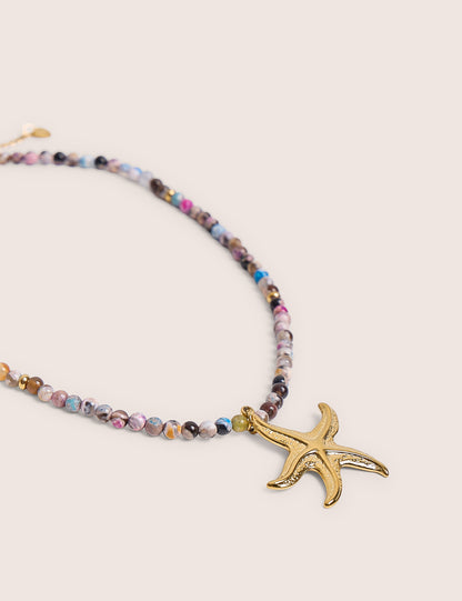 Collar de cuentas multicolores con detalle de estrella de mar