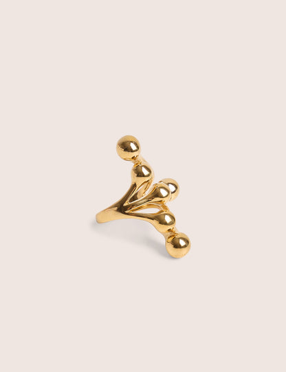 Anillo con detalle de bolas redondas en capas en dorado