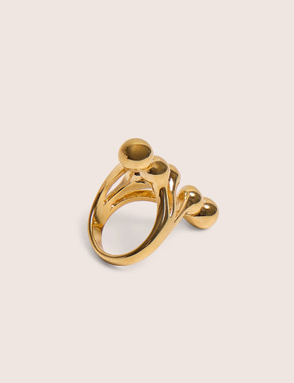 Anillo con detalle de bolas redondas en capas en dorado