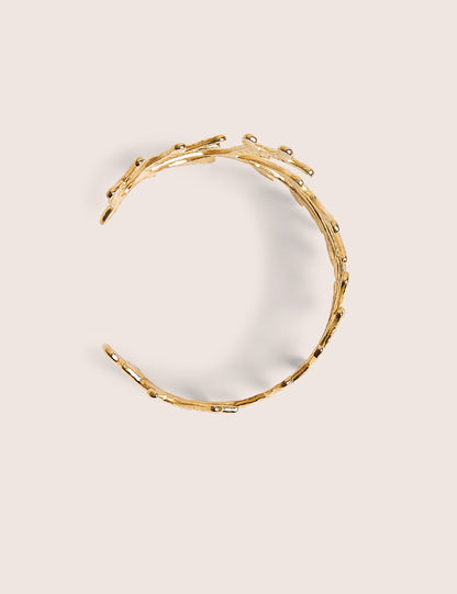 Brazalete inspirado en la vida marina en oro