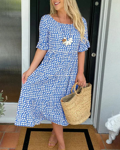 Estrella | Vestido midi relajado con lunares y manga corta