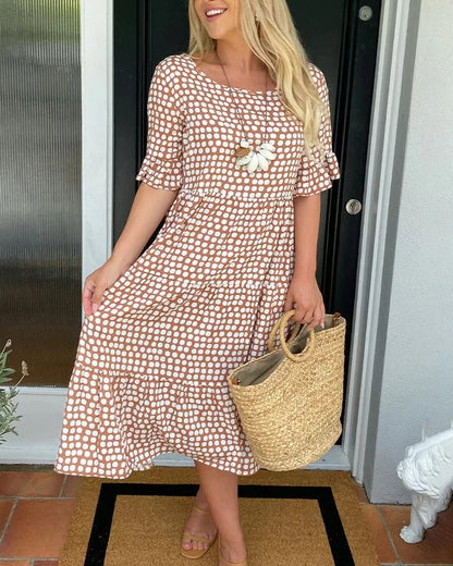 Estrella | Vestido midi relajado con lunares y manga corta