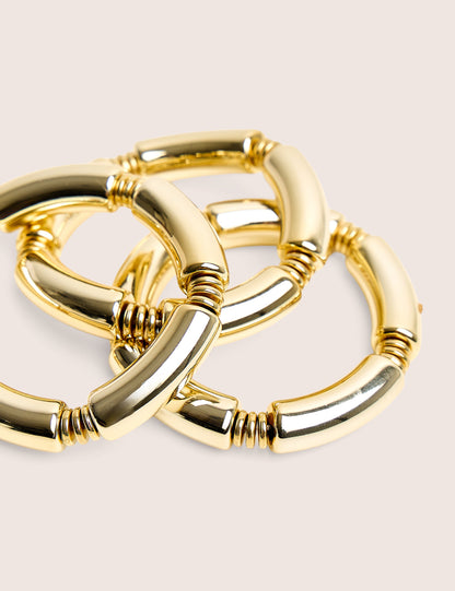 Paquete de tres pulseras de oro