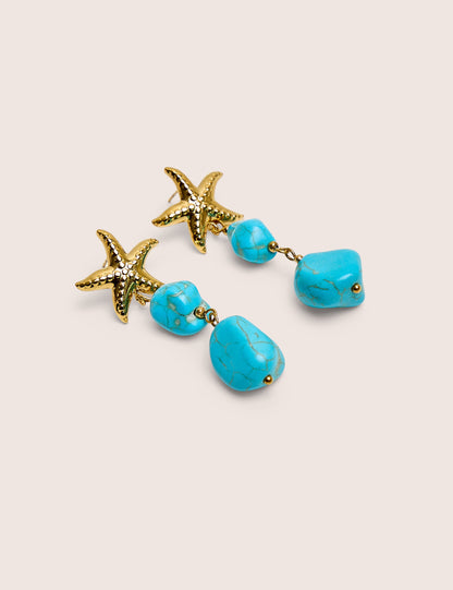 Estrella de mar con detalle y gota de piedra azul en dorado