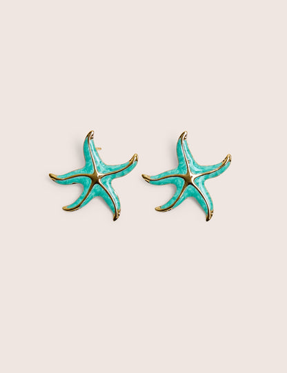 Arete de estrella de mar azul con detalle dorado