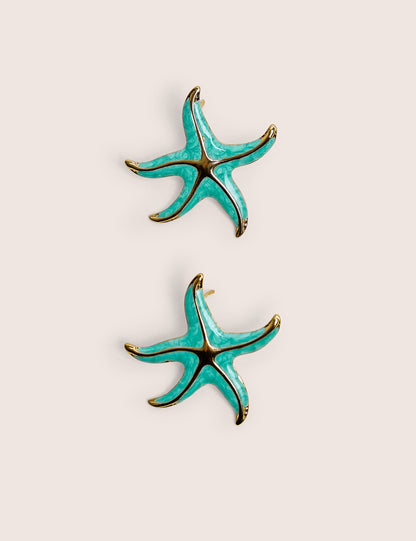 Arete de estrella de mar azul con detalle dorado