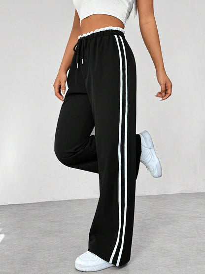 Noelia | Pantalón de Ropa Deportiva Mujer Pierna Ancha Franjas Laterales