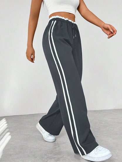 Noelia | Pantalón de Ropa Deportiva Mujer Pierna Ancha Franjas Laterales