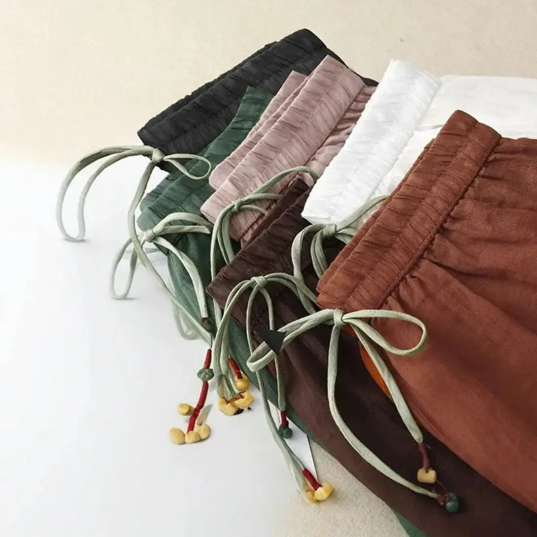 Pantalón de mujer de tiro alto con pernera recta, cordón ajustable y bolsillos laterales